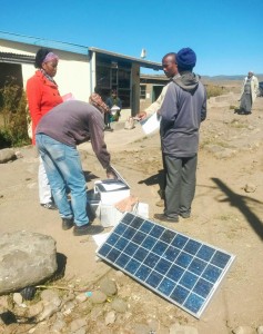 A man sells photocopies powered with solar energy in the marketplace